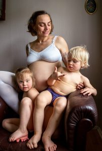 Portrait of a pregnant woman and two children